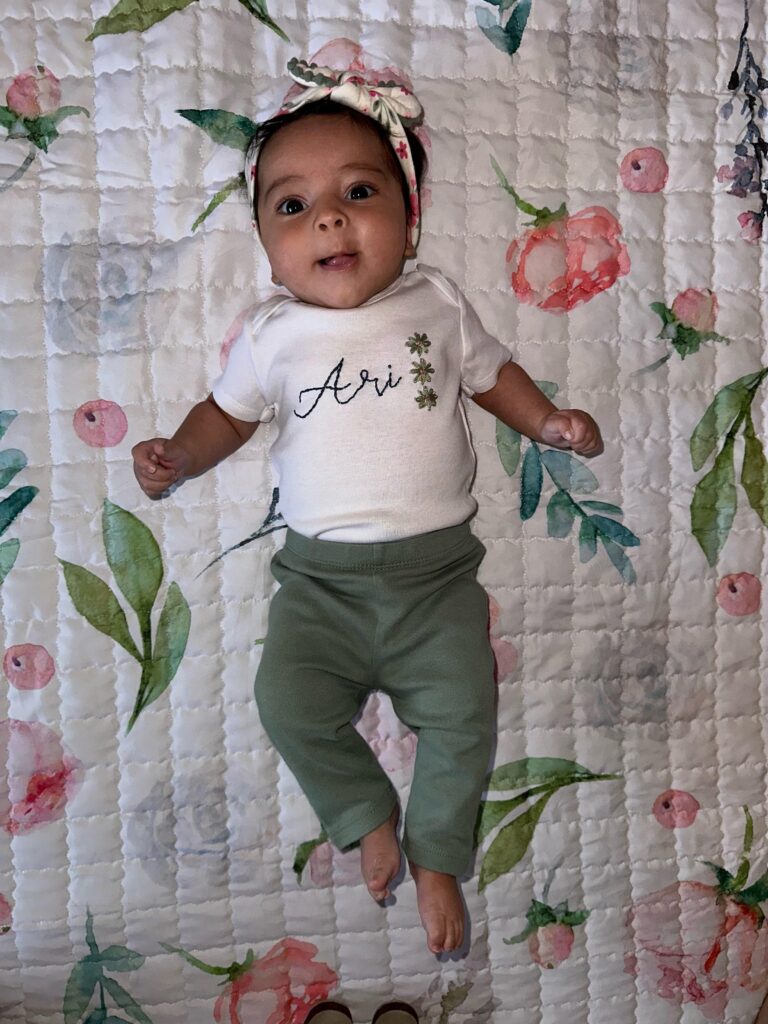 White bodysuit with hand embroidery